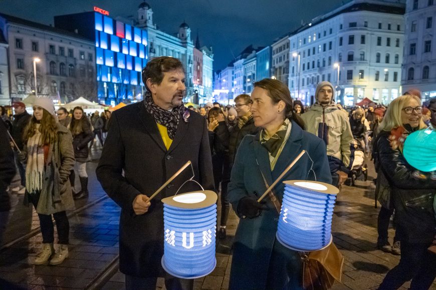 Rector Martin Bareš and Dean of the Faculty of Arts Irena Radová leading the lantern march.